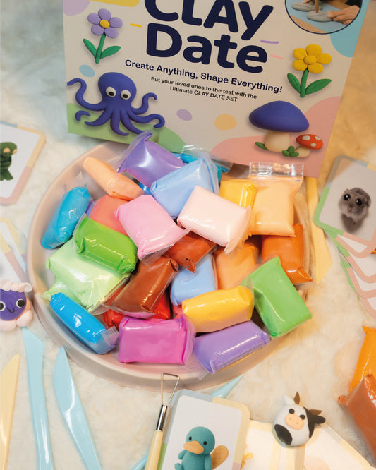 Colorful clay set with 'Clay Date' packaging on a wooden surface.