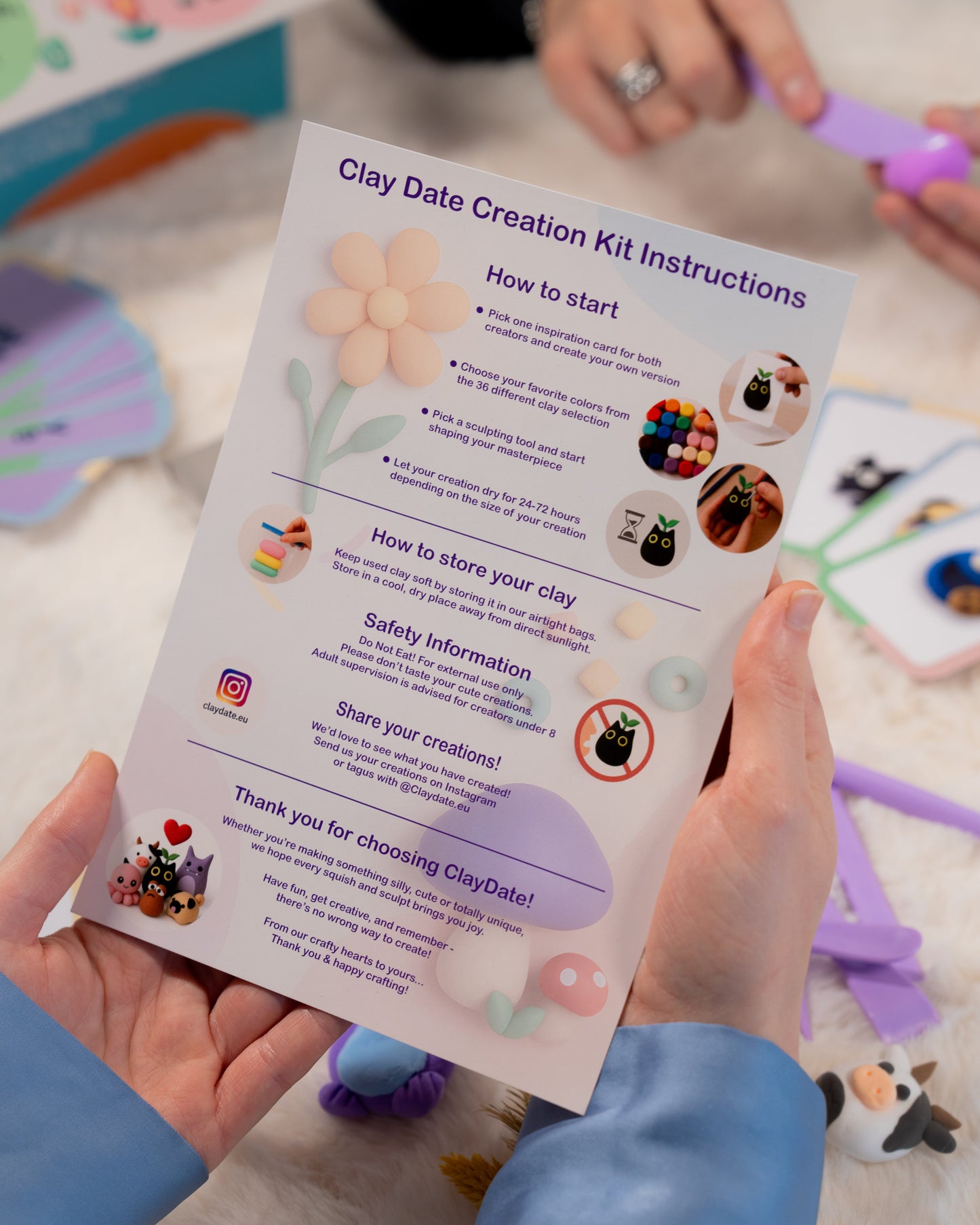 Clay Date Creation Kit Instructions held by a person with clay tools and creations in the background