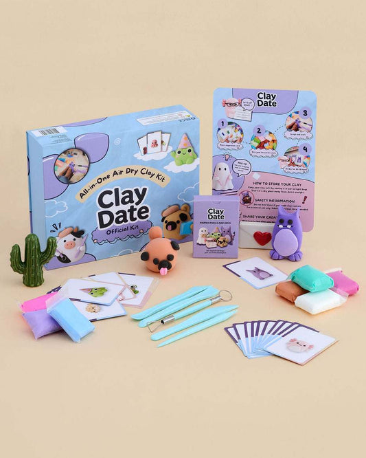 Clay Date™ New Official Kit box with 36 clay colors, sculpting tools and inspiration cards displayed on a pastel background