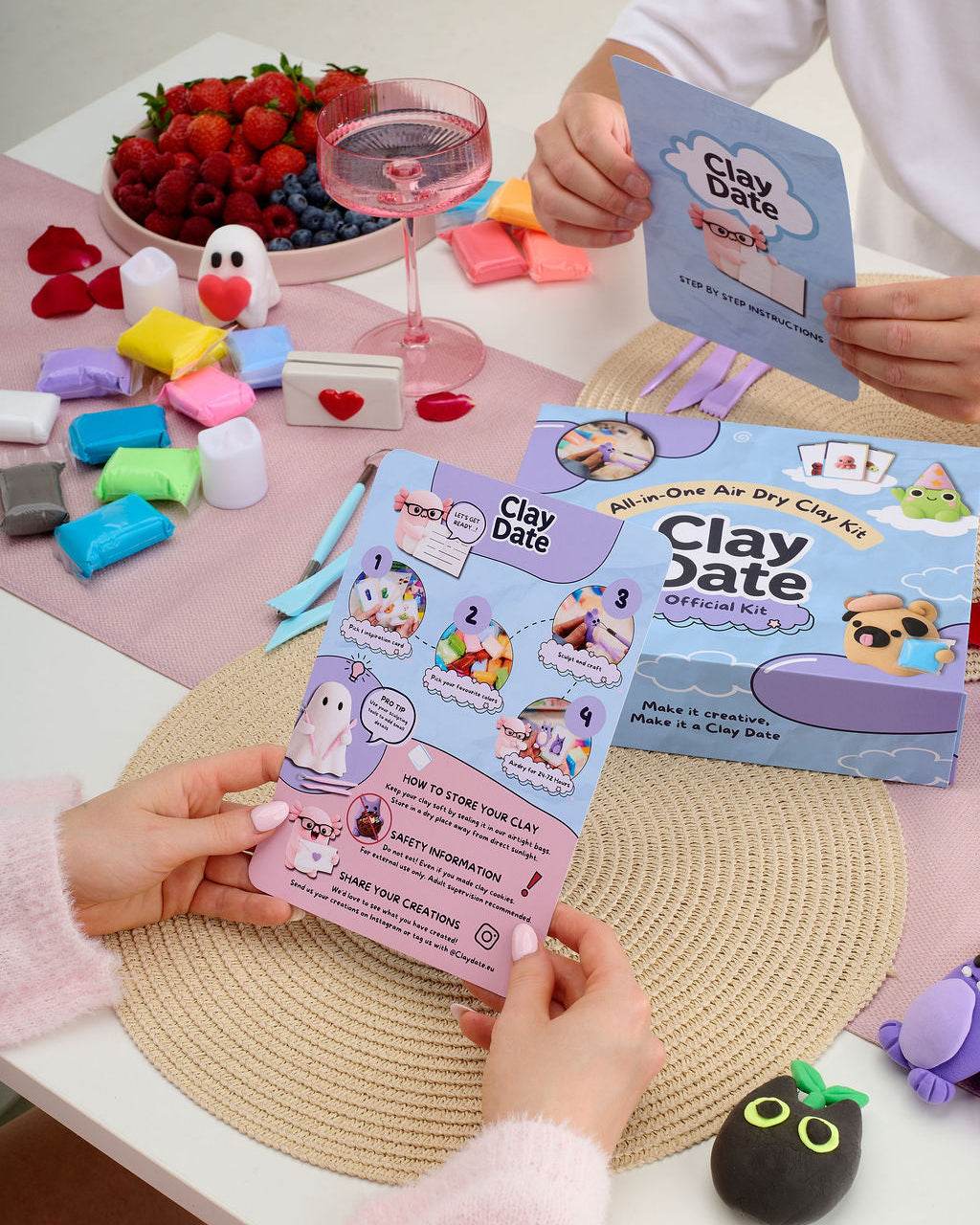 Hand shaping colorful air-dry clay from the Clay Date New Official Kit during a Clay Date
